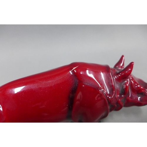 88 - Royal Doulton flambe glazed Rhino, (a/f with hairline crack) 17cm long