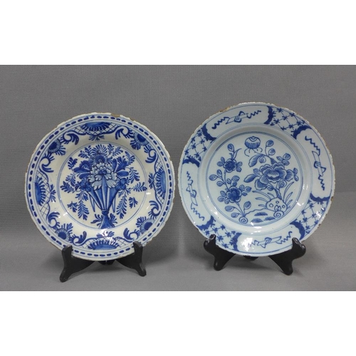 94 - Collection of blue and white tin glazed plates, typically painted with flowers and foliage, some res... 