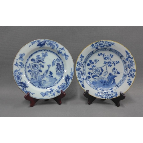 94 - Collection of blue and white tin glazed plates, typically painted with flowers and foliage, some res... 