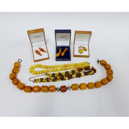 372 - Two pairs of 9ct gold and amber drop earrings, a pair of silver an amber earrings and various amber ... 