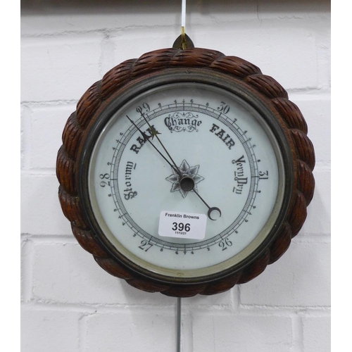 396 - Circular oak framed wall barometer, 23cm diameter