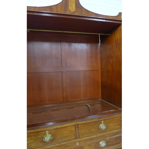 410 - Early 19th century mahogany inlaid linen press, the shaped cornice with a central fan motif and inla... 