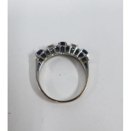 19 - Five stone diamond and sapphire dress ring, the stones claw set to a white metal band, UK ring size ... 