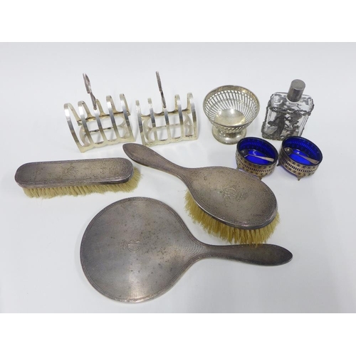 47 - George V silver backed dressing table brush set comprising hand mirror, hair brush and clothes brush... 