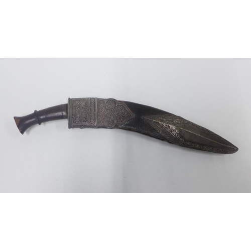 75 - Silver mounted Kukri of traditional form, with a curved steel blade with double fuller and wooden ha... 