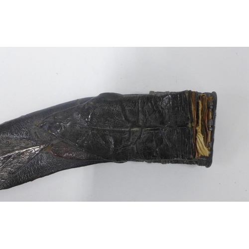 75 - Silver mounted Kukri of traditional form, with a curved steel blade with double fuller and wooden ha... 