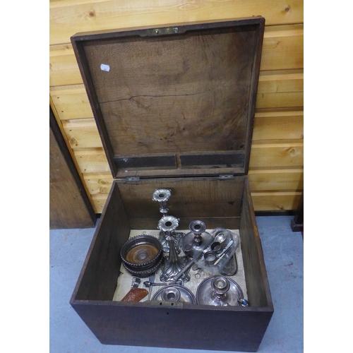 76 - Oak box containing a collection of Epns wares to include wine coasters, chamber candlesticks, etc (a... 