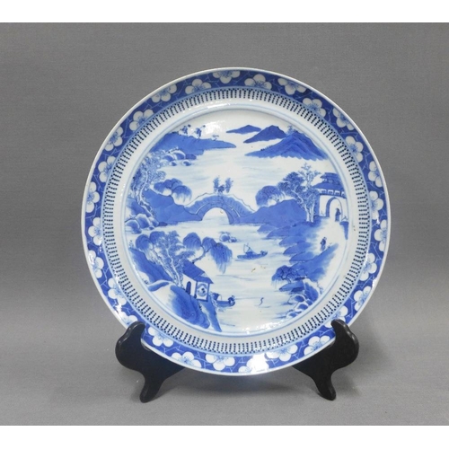 84 - Chinese blue and white porcelain plate,  river and landscape scene within a border of blossom, 24cm