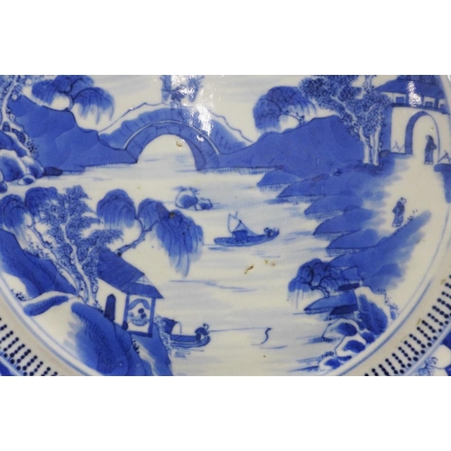 84 - Chinese blue and white porcelain plate,  river and landscape scene within a border of blossom, 24cm