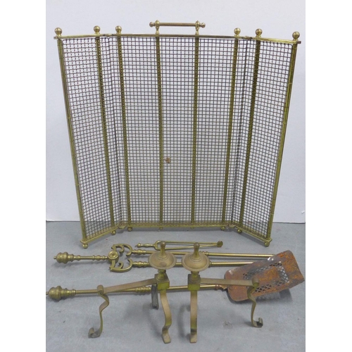 329 - Early 20th century brass three fold spark guard, 68cm high, and brass fire dogs and fireside impleme... 