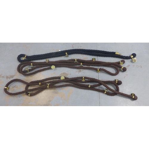 331 - A pair of brown and one black wool banister or wall rope twists with brass attachments, approx 7m  (... 