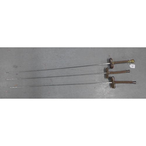 335 - Three foils, one with a brass pommel handle, 107cm long (3)