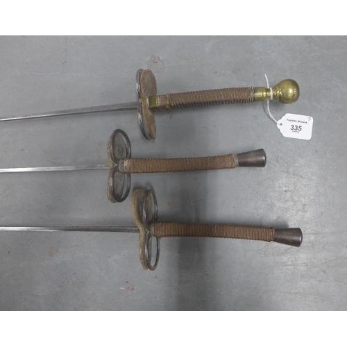 335 - Three foils, one with a brass pommel handle, 107cm long (3)