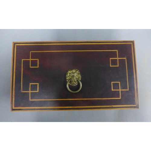 349 - Mahogany and boxwood inlaid box with a rectangular hinged lid and lion mask ring handle, void interi... 