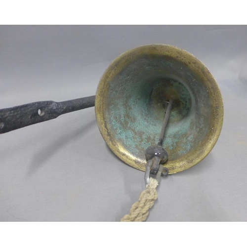 353 - Brass bell with an iron wall bracket, inscribed MFV 1016