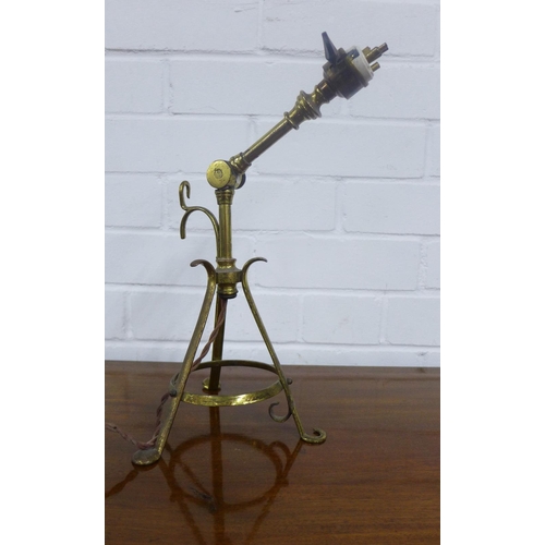 370 - Arts & Crafts brass lamp, in the manner of Benson, with adjustable arm and three outswept legs, appr... 