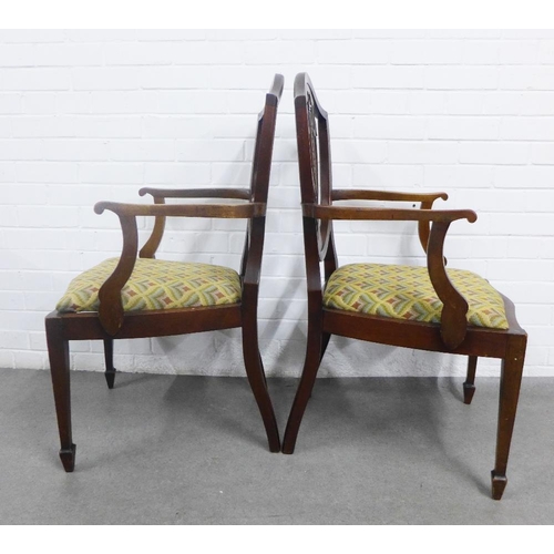 373 - A pair of Hepplewhite style mahogany open armchairs, inlaid shield backs with an urn motif, upholste... 