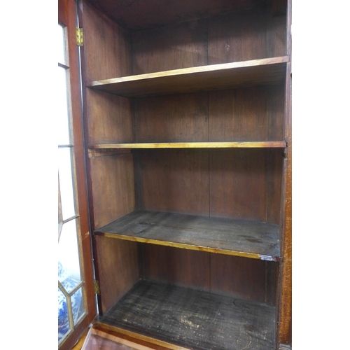 378 - 19th century bureau bookcase cabinet, with a crenuated  top enclosing a clock face and barometer fla... 