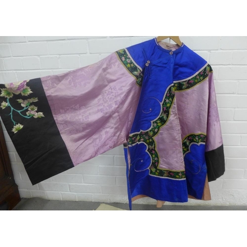 384 - A collection of Chinese embroidered clothing to include a jacket and three wraps / skirts(4)