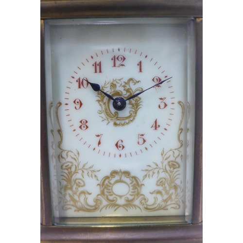 393 - French brass cased carriage clock, the dial with Roman numerals and floral pattern, 15cm including h... 