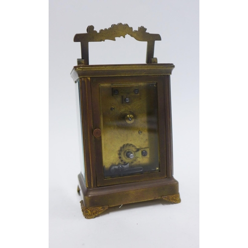 393 - French brass cased carriage clock, the dial with Roman numerals and floral pattern, 15cm including h... 