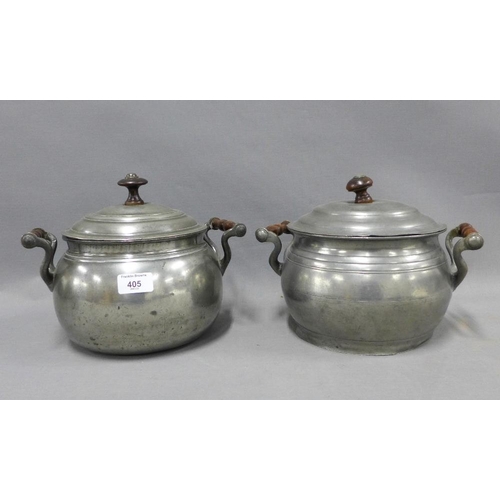 405 - Two early 20th century cooking pots and covers with wooden finials (2)