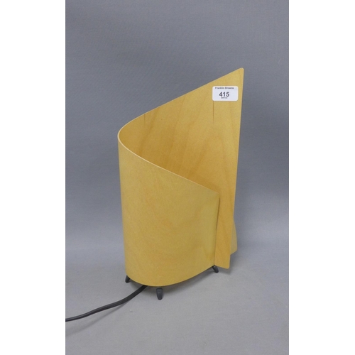 415 - Table lamp with a curved plywood shade, overall height 32cm