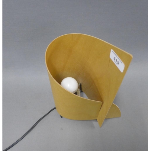 415 - Table lamp with a curved plywood shade, overall height 32cm