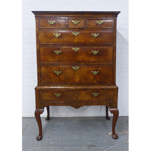 427 - Walnut chest on stand, the rectangular top over three short and three graduating long drawers, the b... 