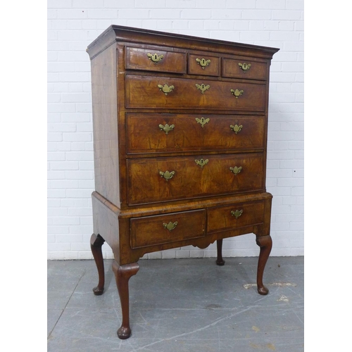 427 - Walnut chest on stand, the rectangular top over three short and three graduating long drawers, the b... 