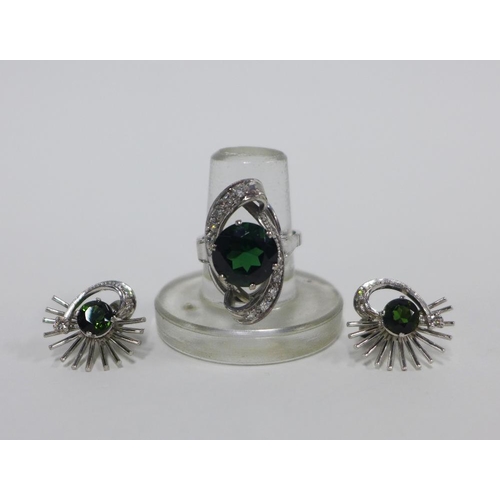 13 - 18ct white gold diamond and tourmaline cocktail dress ring together with a pair of matching earrings... 