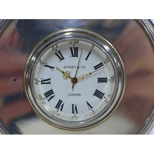 28 - Silver mounted clock, Mappin & Webb, London 1995, enamel dial with roman numerals inscribed Kitney &... 
