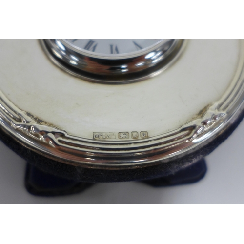 28 - Silver mounted clock, Mappin & Webb, London 1995, enamel dial with roman numerals inscribed Kitney &... 
