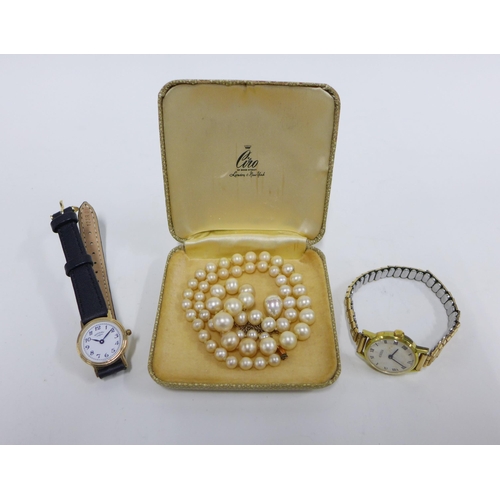 42 - Lady's 9ct gold Rotary wristwatch on a black leather strap together with a vintage Roamer gold plate... 
