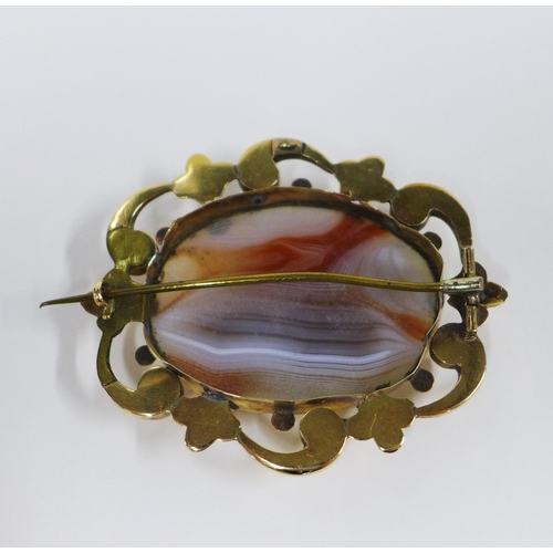 1 - An agate brooch with yellow metal frame and a rolled gold stiff hinged bangle (2)