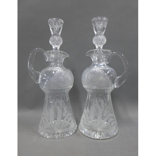 102 - Collection of thistle etched crystal to include a pair of decanters with stoppers, set of seven wine... 