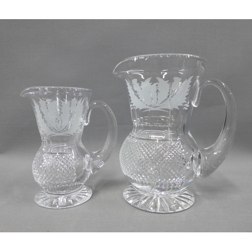 102 - Collection of thistle etched crystal to include a pair of decanters with stoppers, set of seven wine... 