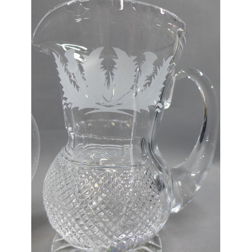 102 - Collection of thistle etched crystal to include a pair of decanters with stoppers, set of seven wine... 