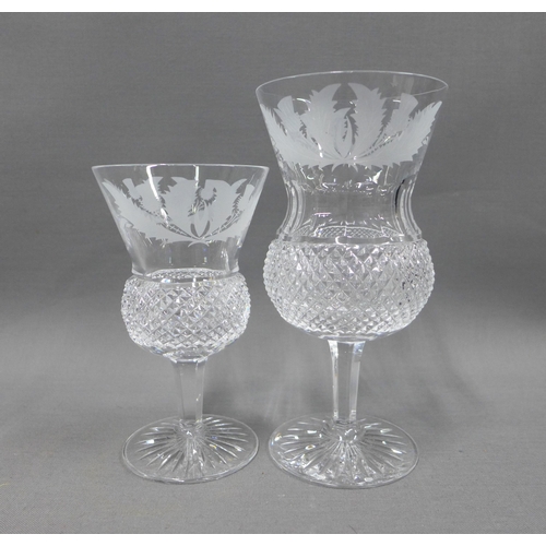 102 - Collection of thistle etched crystal to include a pair of decanters with stoppers, set of seven wine... 