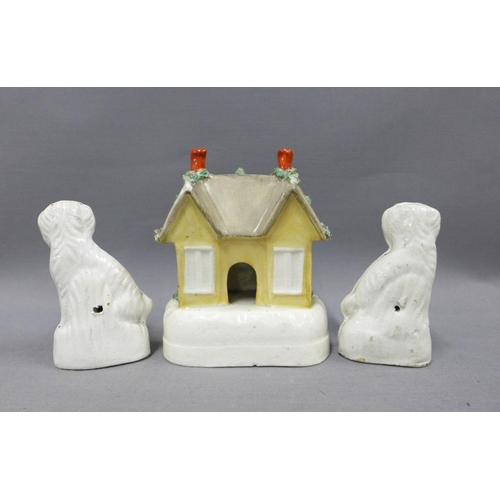 103 - Staffordshire cottage pastille burner and pair of miniature chimney spaniels, (3) tallest 14cm