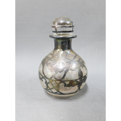 106 - A pair of silver overlaid green glass scent bottles with stoppers and another smaller scent bottle (... 