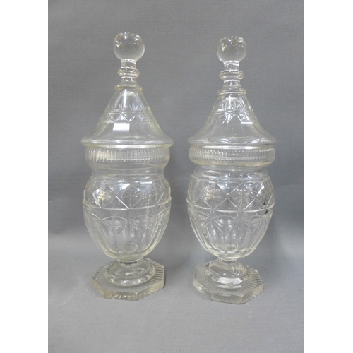 114 - A pair of Georgian glass confitures with covers, on octagonal bases, 33cm (2)