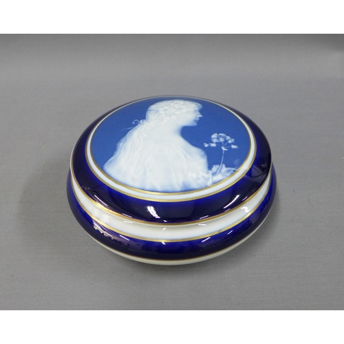 121 - Limoges blue ground pate sur pate style jar and cover, 17cm diameter