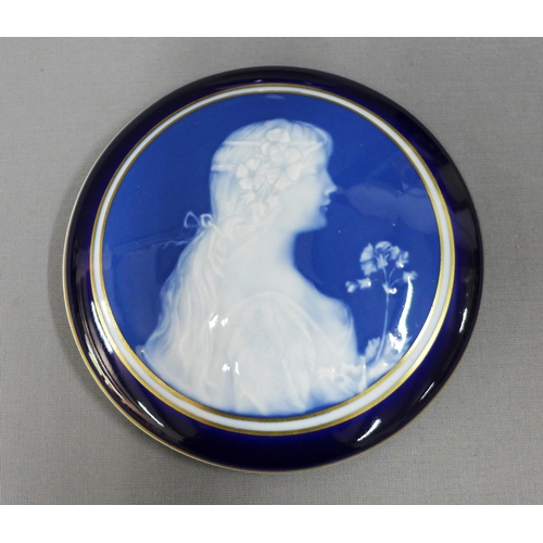 121 - Limoges blue ground pate sur pate style jar and cover, 17cm diameter