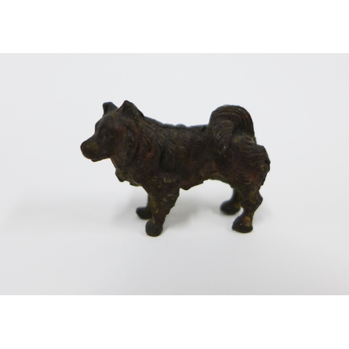 328 - Small leather clad bottle, 11cm and four French pewter vin de taste, miniature bronze dog, 1.5cm and... 