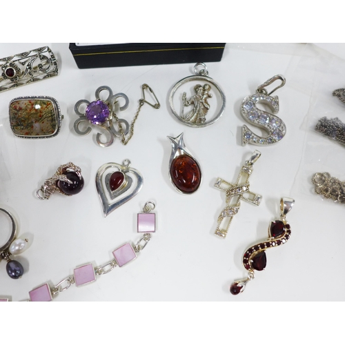 55 - Collection of silver jewellery to include a necklace, earrings, pendants and rings, etc (a lot)...