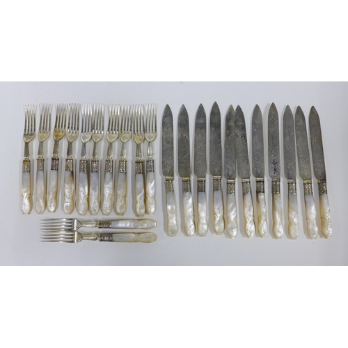 74a - A set of mother of pearl handled fruit knives and forks (a lot)