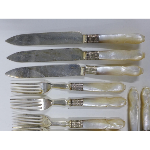 74a - A set of mother of pearl handled fruit knives and forks (a lot)