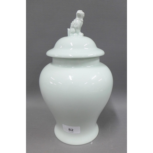 82 - Early 20th century Limoges celadon lidded jar, the cover with a temple lion finial, 27cm