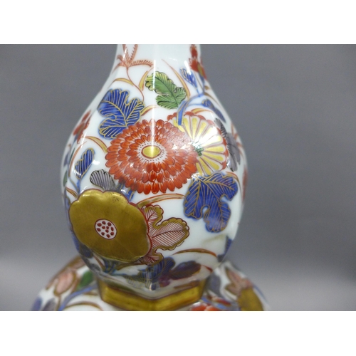 82A - Japanese double gourd vase of octagonal form, double walled with pierced chrysanthemum panels and pa... 